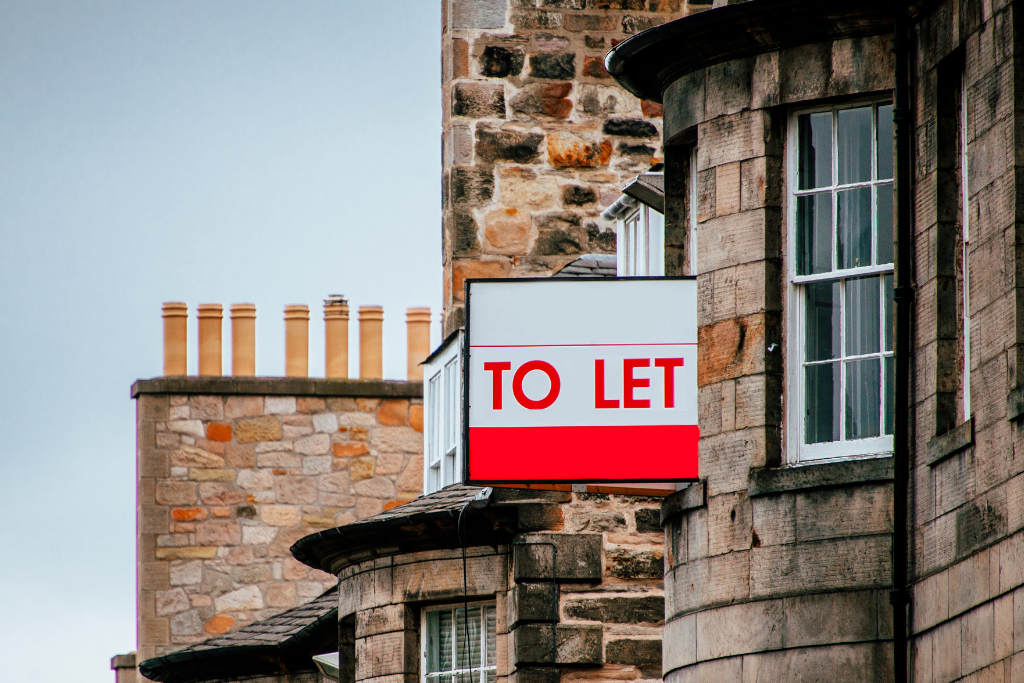 Stone building with To Let sign in red